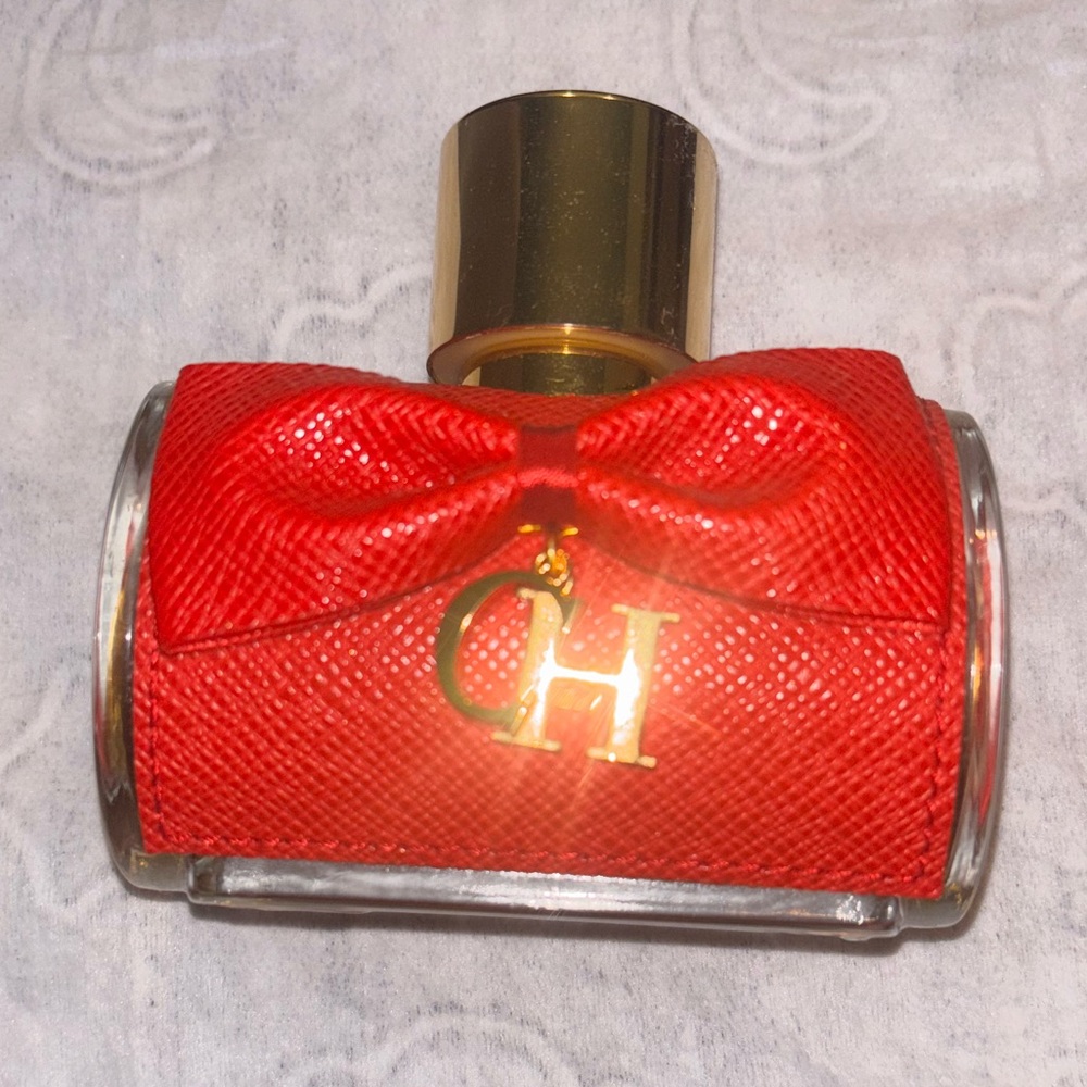 Carolina Herrera Red Perfume Bottle with Gold Accents